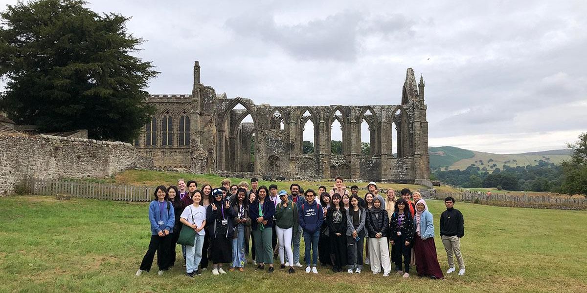 A group of Leeds International Summer School students outside Bolton Abbey