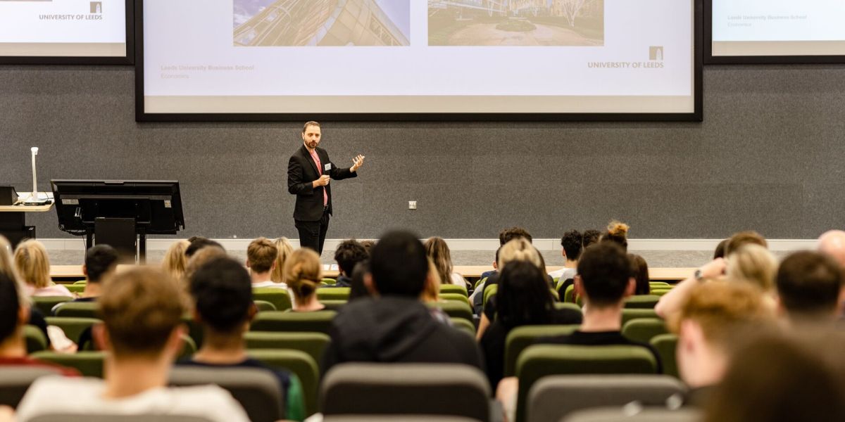 A Leeds University Business School tutor delivers an engaging talk on Economics in the Esther Simpson lecture theatre during the June 2022 Open Day.