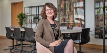 Professor Simone Buitendijk is pictured sitting in an office, smiling