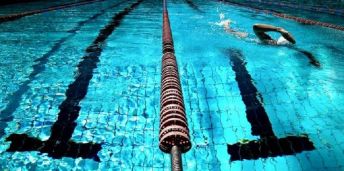 Picture shows someone swimming in a pool.
