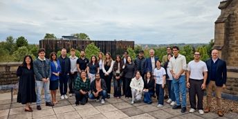 A large group of students with the panel of business experts and programme leaders.