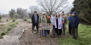 Members of the Seacroft Community Garden group with University of Leeds researchers. pictured at the garden surrounded by trees.