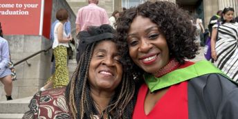 Graduate Memory Moyo in her gowns, pictured with her mother on the famous Parkinson steps
