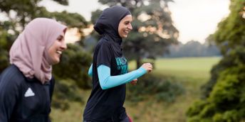 Namrah Shahid, founder of Hijabi Runners, running with a friend.
