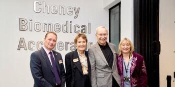 Professor Nick Plant, Susan and Peter Cheney and Professor Karen Birch stood in front of the Cheney Biomedical Research sign in the newly opened centre.