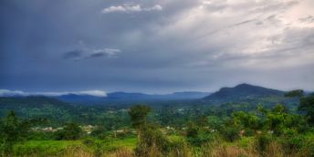 Storm clouds gather in the distance over bush country in Ghana