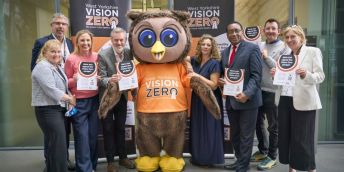 Members of the Leeds Anchor Network mark the Vision Zero pledge with a mascot owl.