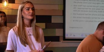 Elysia O' Neill and Della Claydon, who stands to the rear of Elysia present a workshop at Salford Students Union bar.