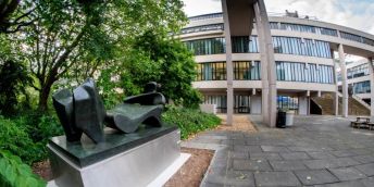Henry Moore Three Piece Reclining Figure No.2: Bridge Prop sculpture in Chancellor's Court with the bridge above the sculpture.