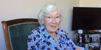 Patient Brenda Iveson sitting in a chair