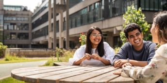 A group of students sitting outside at the University of Leeds