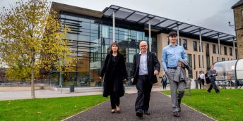 Left to right: Francesca Cuevas walks with Attorney General Lord Hermer and student Callum Keigher outside University of Leeds School of Law
