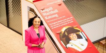 The Lord Mayor of Leeds, Cllr Abigail Marshall Katung with her University of Leeds alum banner.