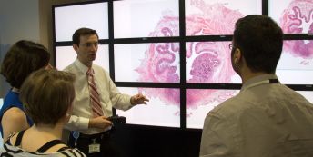 Dr Darren Treanor shows a LVM slide on a Powerwall