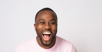 Craig Poku laughs in a profile image