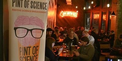 Picture shows people at a Pint of Science talk in Leeds in 2018