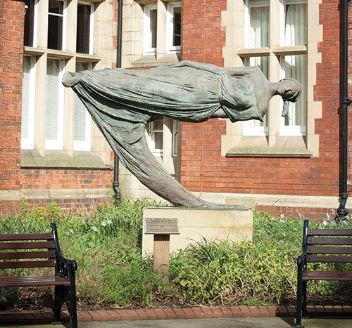 The Dreamer artwork showing a female figure on its side, as though levitating.