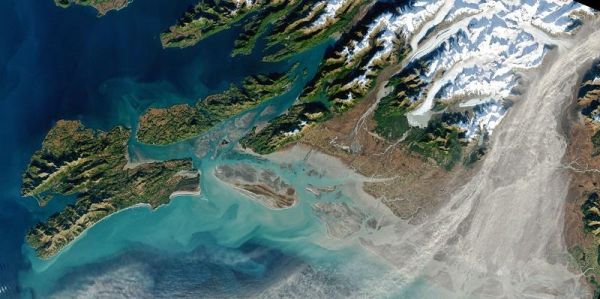 Image taken by a satellite which shows dust billowing out of the Copper River Valley and extending out over the coast and into the atmosphere.