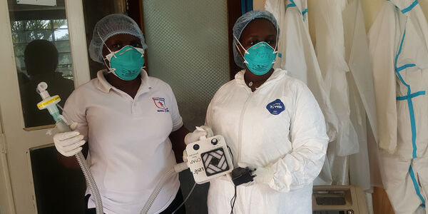 Staff at the Mengo hospital in Kampala, Uganda, show of the low-cost breathing device.