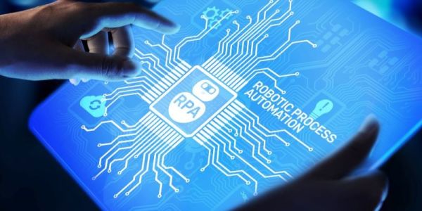 Hands tap on a screen that has graphics of a motherboard on it. In the middle is the text 'robotic process automation'.