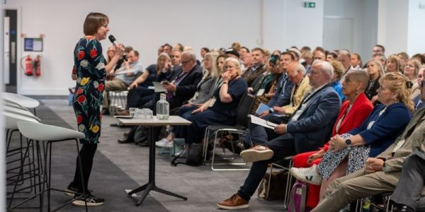 Professor Shearer West presents the Civic Exchange to a large room full of people sat in the audience.
