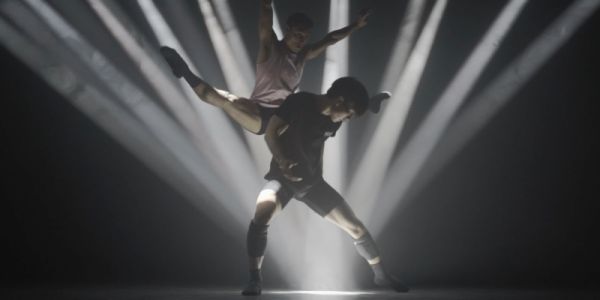 Black and white still of  dancers in motion