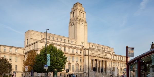 The Parkinson Building at the University of Leeds against a clear, blue sky.