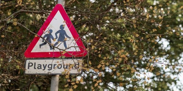 Street sign which says &#039;Playground&#039;