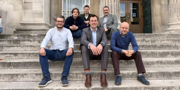 Six men representing Switchdye amd John Hogg sat on steps