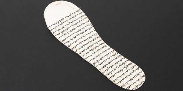 The leather sole of a child’s shoe, crudely cut from a Jewish religious parchment scroll – a Sefer Torah