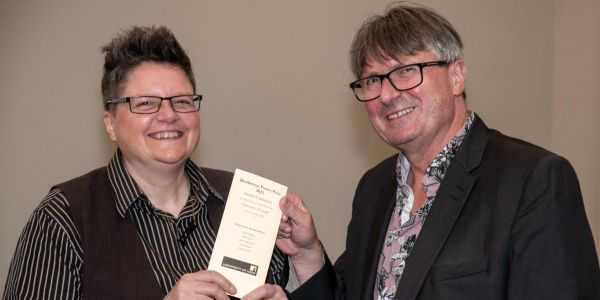 Dillon Jaxx, winner of the 2024 Brotherton Poetry Prize, with Professor of Poetry and Poet Laureate, Simon Armitage, at the Awards Ceremony.