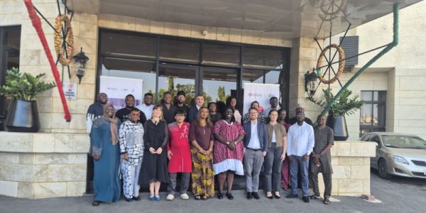 The WASH Systems for Health team outside a hotel following a workshop in Abuja, Nigeria