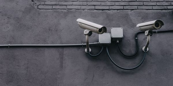 A set of cctv cameras mounted on an external wall.