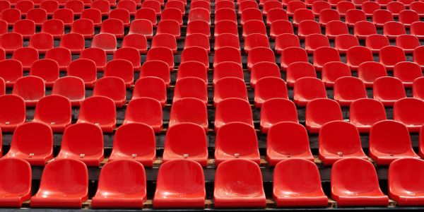 Rows of empty seats in a sports stadium