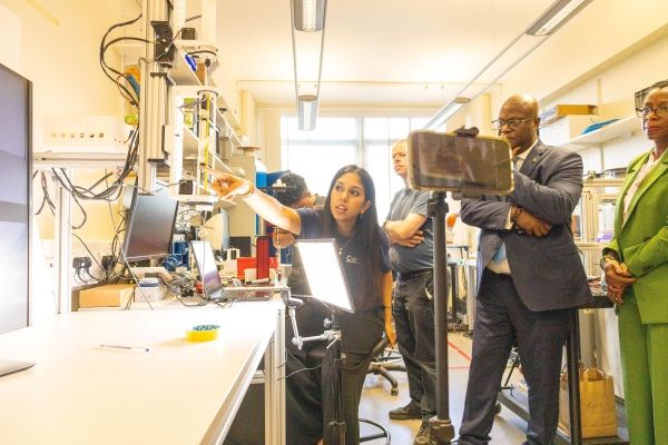 : Renita Bharatsingh showcasing her project with a surgical robotics to the High Commissioner of Saint Vincent and the Grenadines, Professor Kevin Morris and Angela St.Denis and a hybrid online audience.