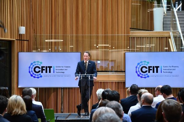 Deputy Vice-Chancellor Nick Park speaks at the launch event for CFIT in front of a guests seated in rows
