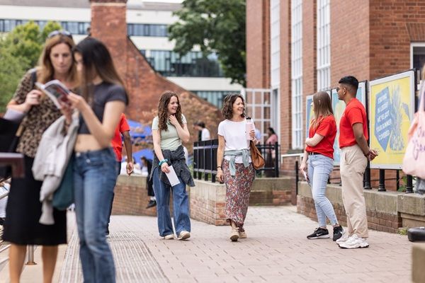 Student ambassadors standing outside LUU, welcoming visitors on Open Day.
