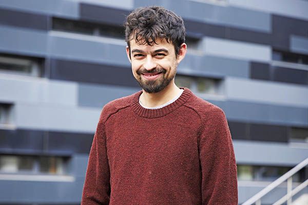 Felipe stood smiling on campus.