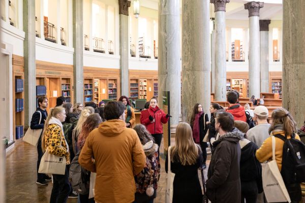 Prospective students and families tour the historic Brotherton Library, guided by a student advisor.