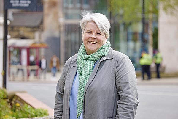 Helen mcglashan portrait. She is smiling on campus.