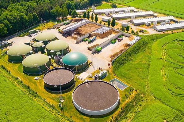 Aerial view of hydrogen ammonia plant surrounded by grass and forest