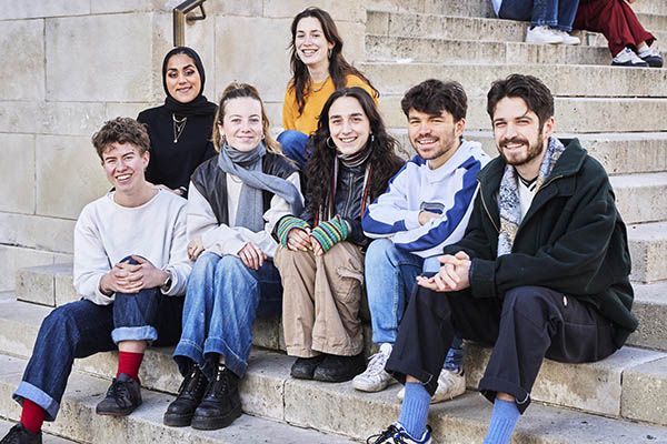 Committee for Leeds STAR, sat smiling on the Parkinson Steps.