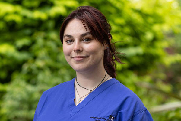 A medical student in scrubs.