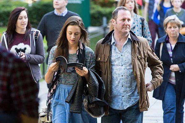Two students with parents/guardians/carers on a campus tour.
