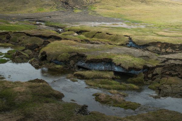 Thawing permafrost in a green landscape in Norway