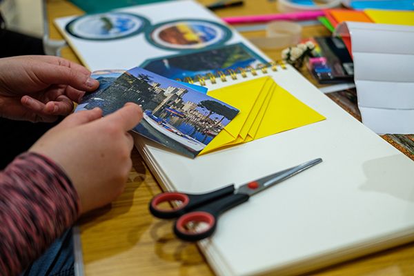 A participant creates a visual display in their journal