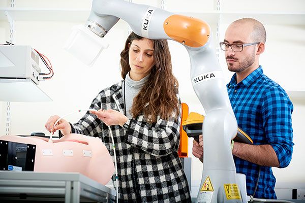 Two students working in the Institute of Robotics, Autonomous Systems and Sensing lab