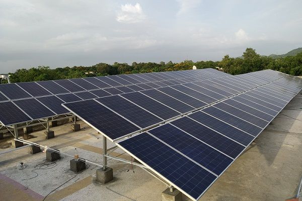 Close up of two long rows of solar panels, outdoors