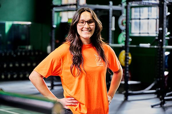 Tineka Jennings standing in a gym smiling at the camera