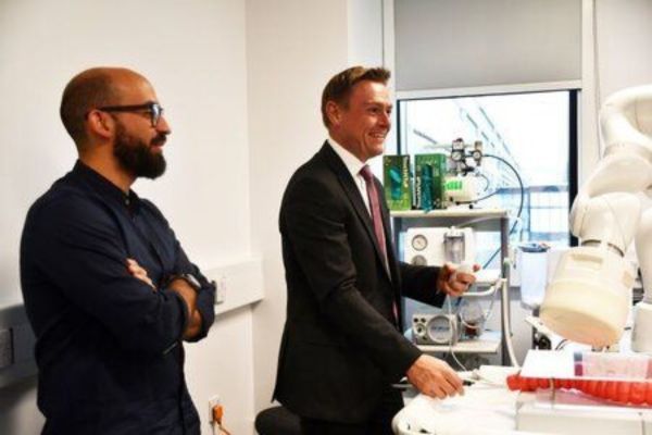 Will Quince MP visiting Nexus, looking at lab equipment.